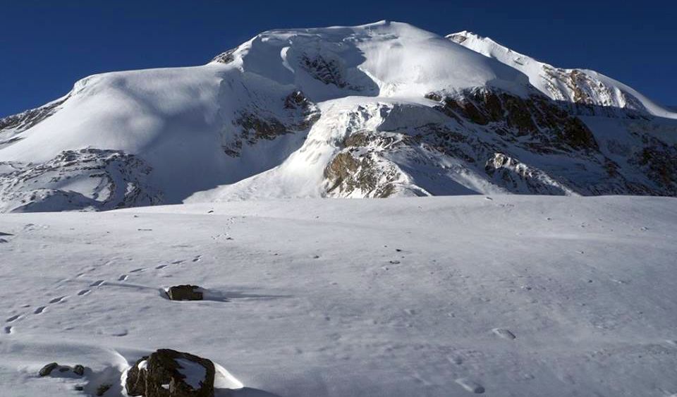 Tharong Peak ( Thorong Ri ) above Tharong La on crossing Tharong La high pass on Annapurna circuit trek in the Nepal Himalaya