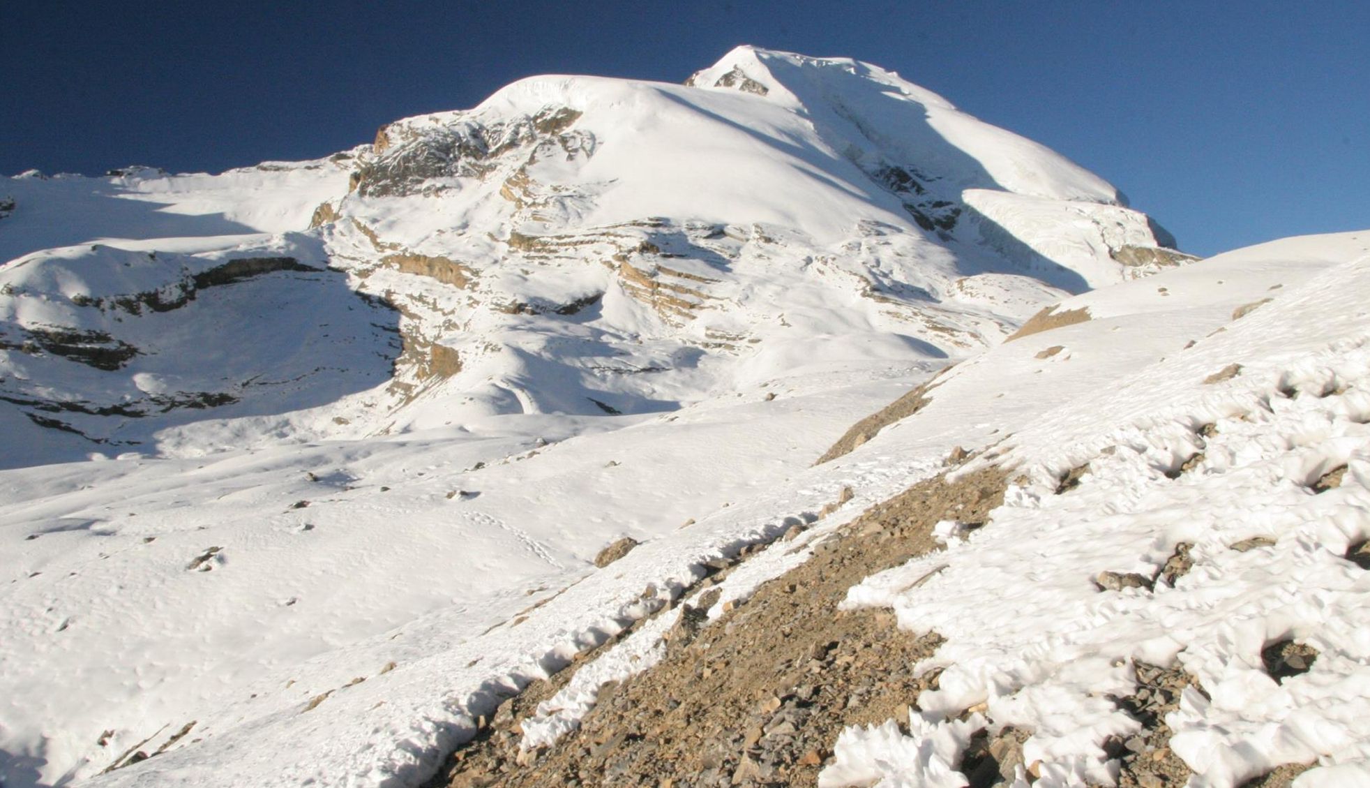 Tharong Peak ( Thorong Ri ) above Tharong La on crossing Tharong La high pass on Annapurna circuit trek in the Nepal Himalaya