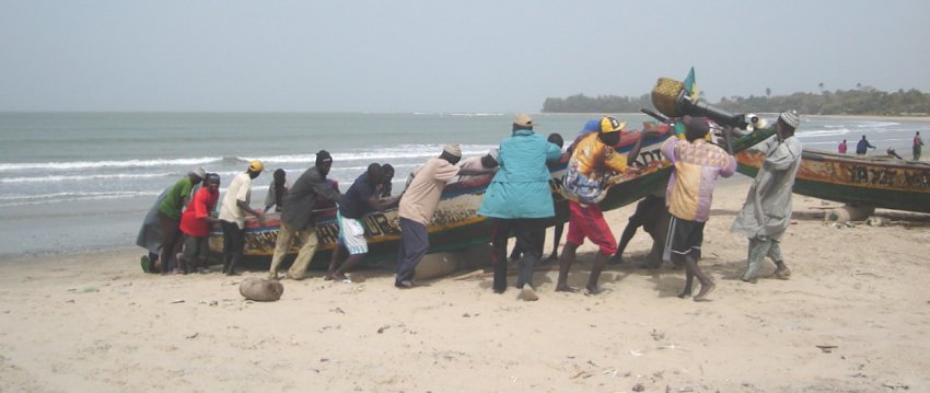 Hauling Fishing Boat onto Beach at Sanyang