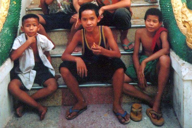 Lao Boys at a Wat ( Buddhist Temple ) in Vientiane - capital city of Laos